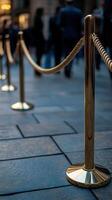 Rope barrier guiding visitors at an urban location during the evening photo