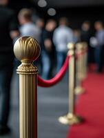 Elegant red carpet setup with rope barriers at a modern event space photo