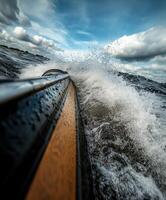 Kayaking through splashing waves under a cloudy sky photo