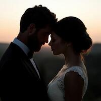 Couple shares intimate moment during sunset on their wedding day photo