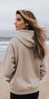 Woman with long hair on beach during cloudy day with ocean view photo