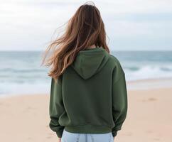 Young woman enjoying a peaceful moment on a beach at sunset photo