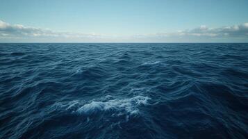 Expansive ocean waves under a clear blue sky at midday photo