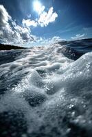 Majestic ocean waves under a bright blue sky with clouds photo