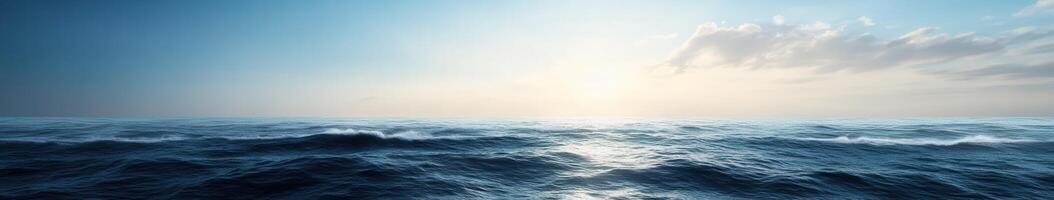 Vast ocean waves under a serene sky at dawn in a tranquil seascape photo