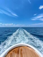 Beautiful view from the bow of a boat sailing on calm ocean waters photo