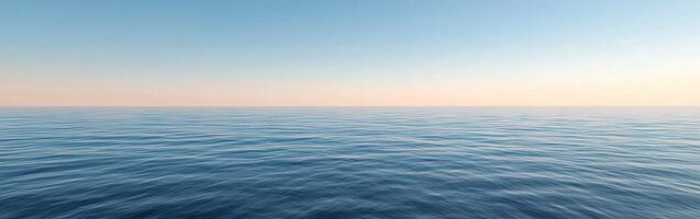 Tranquil ocean view at dusk with gentle waves and clear horizon photo