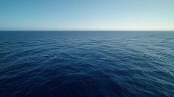 Calm ocean view under clear blue sky during daytime photo