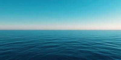 Tranquil blue ocean view under clear sky at sunrise on the horizon photo