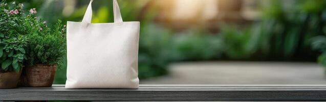 A natural setting with a blank canvas tote bag on a wooden bench photo