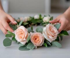 Creating a beautiful floral crown with blush roses and greenery photo