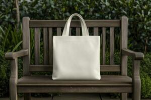 A plain tote bag resting on a wooden bench in a lush garden photo