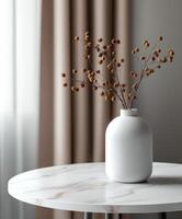 Simple white vase with dried flowers on a marble table in a modern room photo