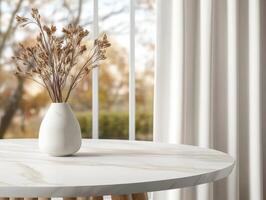 A minimalist vase with dried flowers on a modern round table in daylight photo