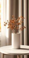 Aesthetic vase with dried leaves on a table in a sunlit room photo