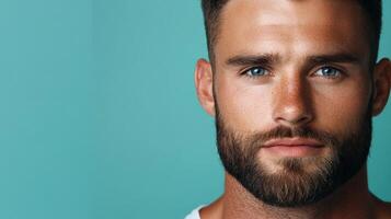 Close-up of a man with a beard against a pastel background indoors photo
