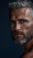 Close-up portrait of a man with a beard in dramatic lighting photo