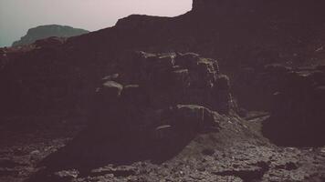 Massive Rock Formation With Mountain in Background video