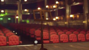 An empty theater with rows of red chairs video
