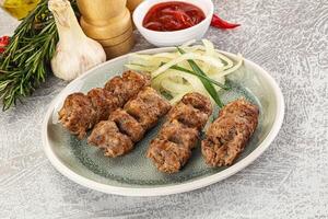 Beef kebab minced meat with onion photo
