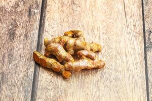 Fresh young Tumeric root heap photo