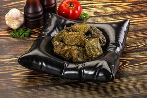 Stuffed dolma - meat in grape leaves photo