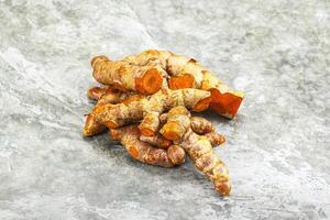 Fresh young Tumeric root heap photo