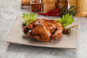 Baked small chicken with spices photo