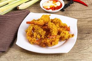 Golden deep prawn tempura wuth sauce photo