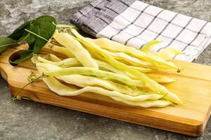 Raw green bean strings heap photo
