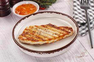 Grilled turkey fillet steak with sauce photo