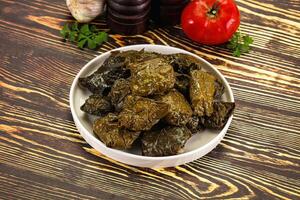 Stuffed dolma - meat in grape leaves photo