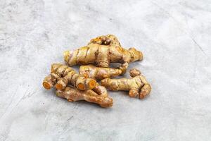 Fresh young Tumeric root heap photo