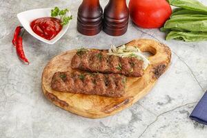 Kebab with beef served onion photo