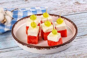 Watermelon with feta and grape photo