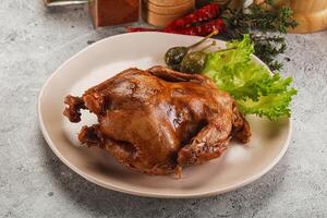 Baked small chicken with spices photo