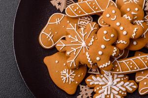 Homemade Christmas gingerbread cookies made as sweets photo