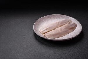 Herring fillet salted and marinated with salt, spices and oil photo