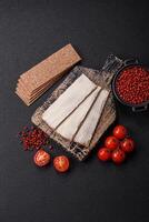 Rectangular whole grain crisp bread with cream cheese photo