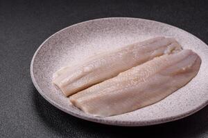 Herring fillet salted and marinated with salt, spices and oil photo