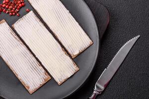 Rectangular whole grain crisp bread with cream cheese photo