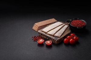 Rectangular whole grain crisp bread with cream cheese photo