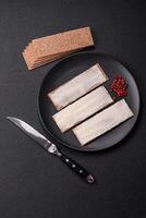 Rectangular whole grain crisp bread with cream cheese photo