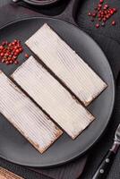 Rectangular whole grain crisp bread with cream cheese photo
