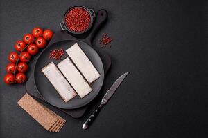 Rectangular whole grain crisp bread with cream cheese photo