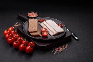 Rectangular whole grain crisp bread with cream cheese photo
