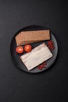 Rectangular whole grain crisp bread with cream cheese photo