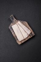 Rectangular whole grain crisp bread with cream cheese photo