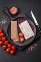 Rectangular whole grain crisp bread with cream cheese photo