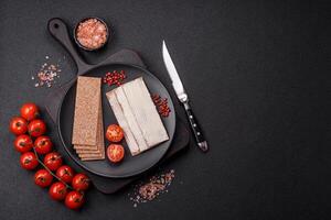 Rectangular whole grain crisp bread with cream cheese photo